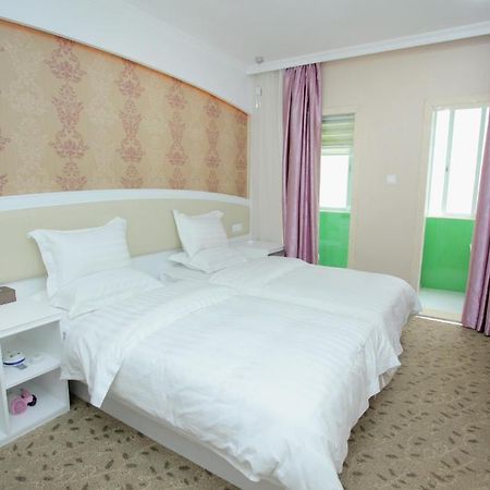 Xinghe Xinfeng Hotel Kuangcsou Szoba fotó