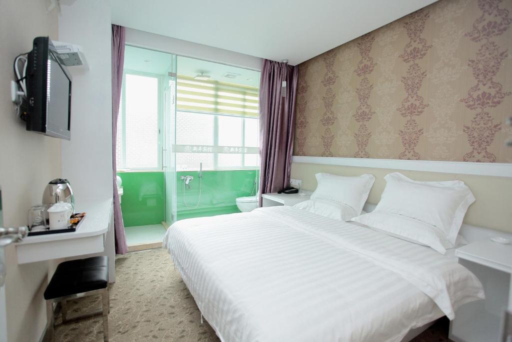 Xinghe Xinfeng Hotel Kuangcsou Szoba fotó