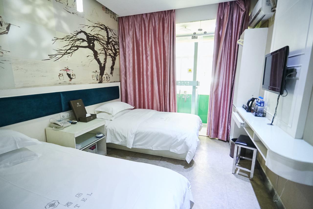 Xinghe Xinfeng Hotel Kuangcsou Kültér fotó